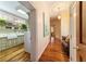 Hallway with hardwood floors and laundry room access at 7819 Se 12Th Cir, Ocala, FL 34480