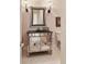 Modern bathroom with a mirrored vanity and neutral tile flooring at 7819 Se 12Th Cir, Ocala, FL 34480