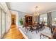 Elegant dining room with hardwood floors, chandelier, and large windows at 7819 Se 12Th Cir, Ocala, FL 34480