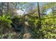 Charming path leading through a lush, manicured garden at 7819 Se 12Th Cir, Ocala, FL 34480