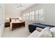 Comfortable bedroom with a queen-size bed and a built-in sofa at 7819 Se 12Th Cir, Ocala, FL 34480