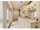 Elegant bathroom with double vanity and large windows at 7819 Se 12Th Cir, Ocala, FL 34480