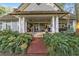 Inviting front porch with columns and seating at 7819 Se 12Th Cir, Ocala, FL 34480
