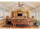 Spacious living room with built-in entertainment center and hardwood floors at 7819 Se 12Th Cir, Ocala, FL 34480