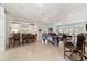 Gathering room featuring a game table, comfortable seating and kitchen views at 7819 Se 12Th Cir, Ocala, FL 34480