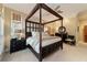 Bright bedroom with a four-poster bed and ample closet space at 7819 Se 12Th Cir, Ocala, FL 34480