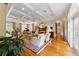 Bright living room with hardwood floors, fireplace, and coffered ceiling at 7819 Se 12Th Cir, Ocala, FL 34480