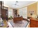 Bright home office features built-in bookshelves and a large desk at 7819 Se 12Th Cir, Ocala, FL 34480