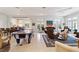 Spacious Gathering room with comfortable seating, a piano and air hockey table at 7819 Se 12Th Cir, Ocala, FL 34480