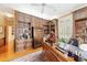 Home office with custom built-ins, hardwood floors, and large windows at 7819 Se 12Th Cir, Ocala, FL 34480