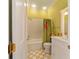 Clean bathroom with shower/tub combo and cheerful wallpaper at 7819 Se 12Th Cir, Ocala, FL 34480
