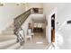 Elegant entryway with a sweeping staircase and views into the home at 7819 Se 12Th Cir, Ocala, FL 34480