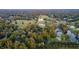 Aerial view of a golf course community with houses and lakes at 7819 Se 12Th Cir, Ocala, FL 34480