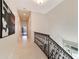 Upstairs hallway with light flooring and a view of a home gym at 7819 Se 12Th Cir, Ocala, FL 34480