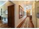 Light-filled hallway featuring hardwood floors and built-in storage at 7819 Se 12Th Cir, Ocala, FL 34480