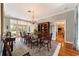 Formal dining room with hardwood floors, chandelier, and large windows at 7819 Se 12Th Cir, Ocala, FL 34480