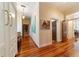 Long hallway with hardwood floors and plenty of natural light at 7819 Se 12Th Cir, Ocala, FL 34480