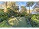 Landscaped putting green, perfect for practicing your game at 7819 Se 12Th Cir, Ocala, FL 34480