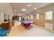 Fun game room with ping pong table and arcade game at 7819 Se 12Th Cir, Ocala, FL 34480