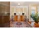 Elegant entryway with hardwood floors, antique furniture, and large windows at 7819 Se 12Th Cir, Ocala, FL 34480