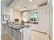 Modern kitchen featuring white cabinetry, granite countertops, and stainless steel appliances at 7819 Se 12Th Cir, Ocala, FL 34480