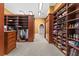 Large walk-in closet with ample shelving and hanging space at 17800 Se 237Th Ct, Umatilla, FL 32784