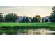 Serene lakefront property with tranquil water and lush greenery at 17800 Se 237Th Ct, Umatilla, FL 32784