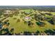 Aerial view of expansive property with a large house, pool, and lush green landscape at 17800 Se 237Th Ct, Umatilla, FL 32784