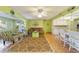 Living room and kitchen area with light walls, tiled floors, and comfortable seating at 9257 Sw 82Nd Ter # H, Ocala, FL 34481