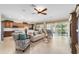 Comfortable living room featuring neutral color palette and sliding glass doors at 7335 Sw 97Th Terrace Rd, Ocala, FL 34481