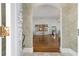 Bright entryway with hardwood floors and view into the living room at 1218 Se 11Th St, Ocala, FL 34471