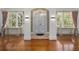 Spacious entryway with hardwood floors, and large windows at 1218 Se 11Th St, Ocala, FL 34471