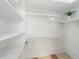 Bright white closet offers shelves and hanging space for clothes at 1218 Se 11Th St, Ocala, FL 34471