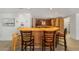 Kitchen with breakfast bar and light wood cabinetry at 1218 Se 11Th St, Ocala, FL 34471