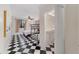 Bedroom with a queen bed, a bunk bed, and black and white checkerboard floors at 1218 Se 11Th St, Ocala, FL 34471