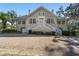 Two story house, gray siding, white trim, brick driveway at 1218 Se 11Th St, Ocala, FL 34471