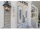 Elegant double front doors with ornate carvings and sidelights at 1218 Se 11Th St, Ocala, FL 34471