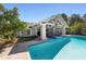 Luxury pool and spa with covered patio and lounge chairs at 1218 Se 11Th St, Ocala, FL 34471