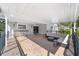 Covered patio with outdoor seating and kitchen area at 1218 Se 11Th St, Ocala, FL 34471