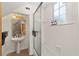 Clean bathroom with pedestal sink, shower, and large window at 1218 Se 11Th St, Ocala, FL 34471