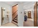 Bright entryway with staircase, view of laundry, and front door at 1218 Se 11Th St, Ocala, FL 34471