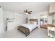 Bedroom with queen bed, white linens, and access to the patio at 1218 Se 11Th St, Ocala, FL 34471