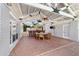 Large covered patio with dining area and backyard view at 1218 Se 11Th St, Ocala, FL 34471