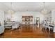 Open living room with hardwood floors, chandelier, and ample seating at 1218 Se 11Th St, Ocala, FL 34471