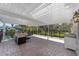 Relaxing covered patio space with seating area and view of the backyard at 1218 Se 11Th St, Ocala, FL 34471