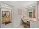 Charming bathroom with vanity, a walk-in shower, and floral wallpaper at 1218 Se 11Th St, Ocala, FL 34471