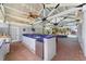 Outdoor kitchen with stainless steel appliances and blue tile backsplash at 1218 Se 11Th St, Ocala, FL 34471