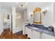 Sophisticated bathroom with a marble-topped vanity and bathtub at 1218 Se 11Th St, Ocala, FL 34471