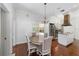Charming dining room features hardwood floors and a chandelier at 1218 Se 11Th St, Ocala, FL 34471
