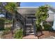 Home exterior showcasing deck and stairs leading to backyard at 1218 Se 11Th St, Ocala, FL 34471
